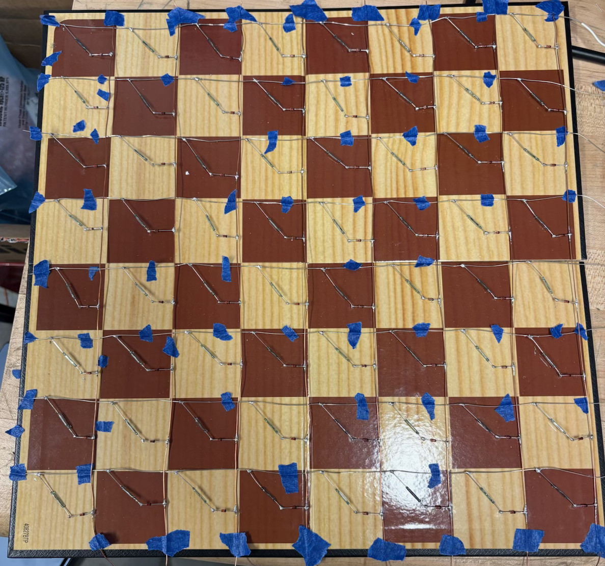 Physical chessboard with reed switches mounted on each square