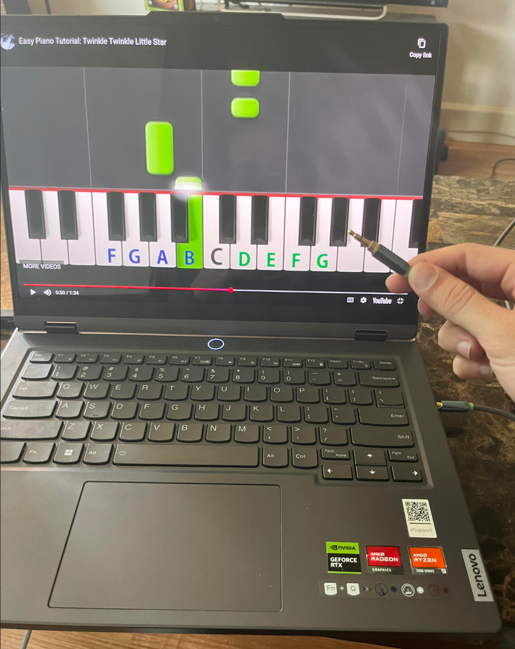 Computer transmitting audio from video via audio jack
